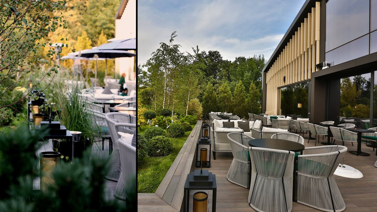 Terasa restaurantului de la Stejarii Country Club, cu felinarele negre FD.STIL așezate pe bordura de lemn, între jardiniere și fotoliile de răchită